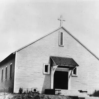 Prior to this first building, services were being held in tents that had been set up on tw